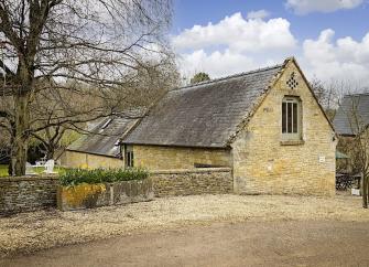 A Luxury Cotswold Farm Barn Conversion within a walled garden.