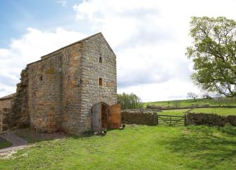 Exterior of a sympathetically restored 3-storey farmhouse in County Durham.