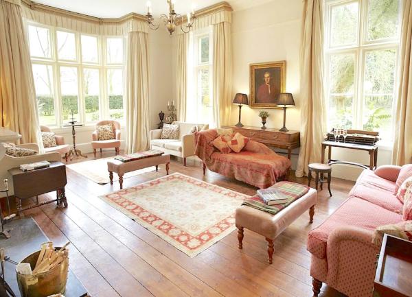 A luxury lounge with three floor-to-ceiling windows.