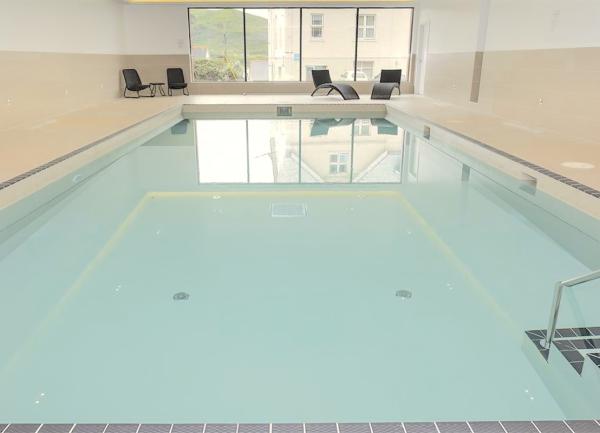 Heated indoor swimming pool with a sauna.