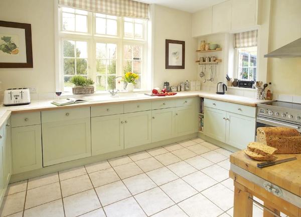 A stylish modern fitted kitchen with integrated appliances.