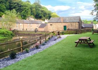 Large, stone-built, 3-storey, waterside Peak District holiday cottage.