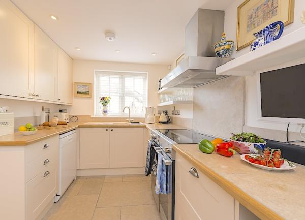 Fitted kitchen units with integrated dishwasher, oven and microwave.
