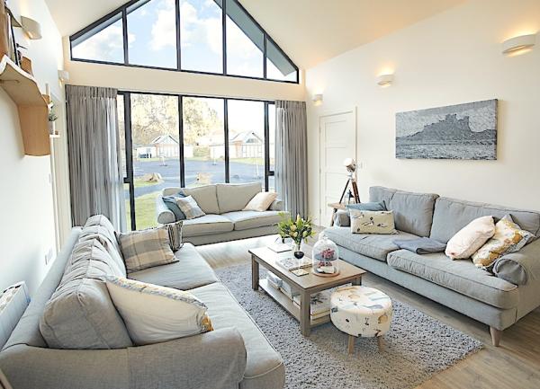 Lounge with glass arched window filling a gable end