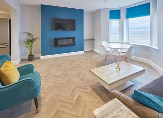 Stylish bay-windowed lounge with seafront views.