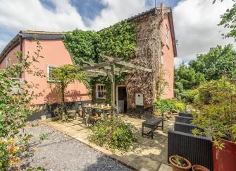 View exterior and interior photos of Pillar Box House in Norfolk.