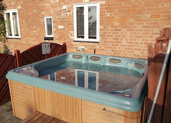 A garden hot tub on a terrace in Shakespeare country.