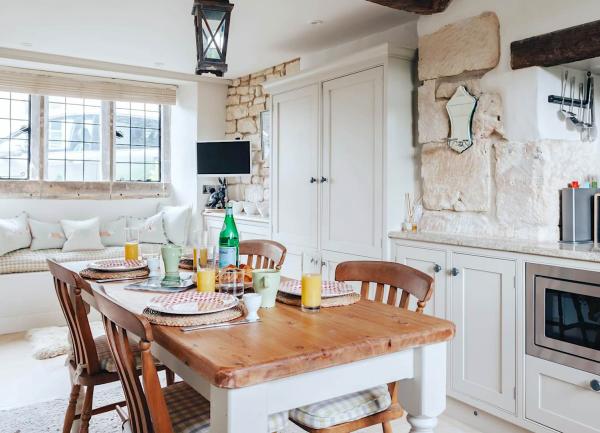 Cotswold cottage kitchen with a dining table.