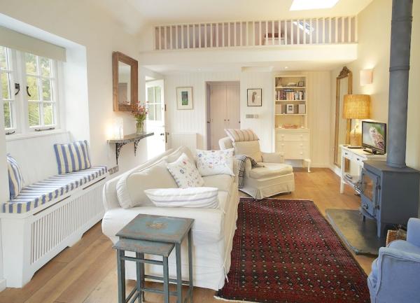 A lounge with a wood burner in a North Cornwall holiday Cottage.