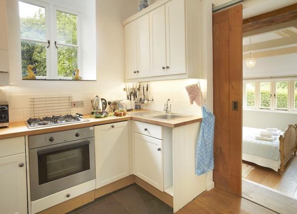 A rural cottage kitchen with a  gas cooker.