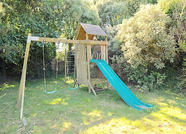 Children's play equipment in a garden.