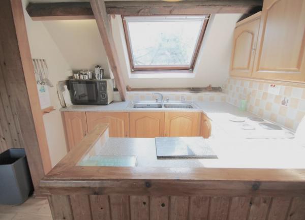 A com[act country cottage kitchen in a Somerset coast barn conversion.JPG