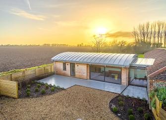 1. A contemporary barn conversion surrounded by open countryside.