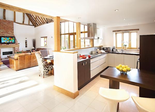 A fitted kitchen with a breakfast bar.