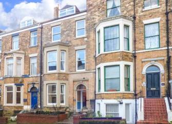 Terraced, 4-storey, Victorian Seaside Townhouse with bay windows.