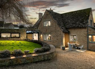 Exterior of Culls Cottage holiday home at night