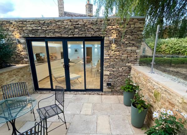Garden seating area outside the large kitchen windows.