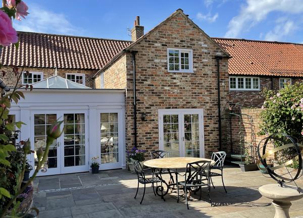 The outside seating area in the walled garden at Pear Tree House 