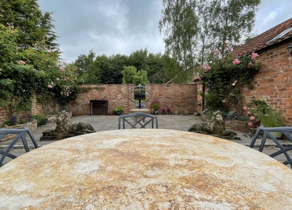 The walled garden from the Italian marble table