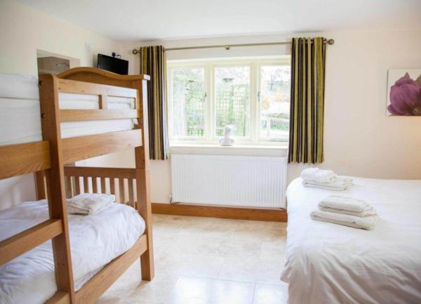 Cream bedroom with bed and bunkbed