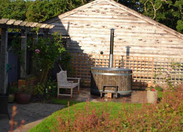 Wood fueled hot tub set in a garden 