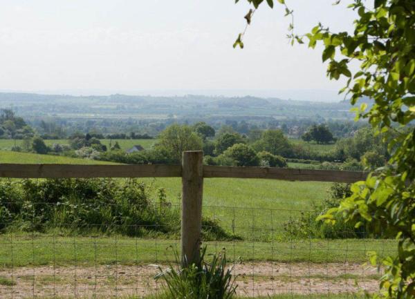 Fenced garden with views of English countryside 