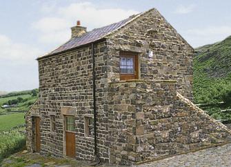 A remote 2-storey barn conversion in a moorland location.