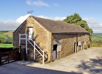 A 2-storey barn conversion with a courtyard and far-reaching rural views