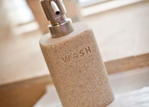Handwash earthen bottle on sink.