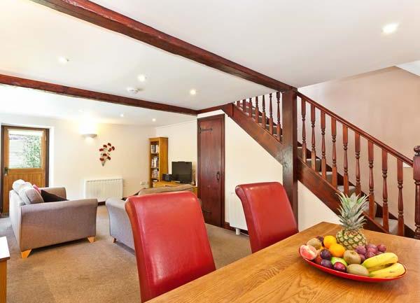 Dining table with fruit bowl and chairs