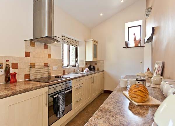 Fitted kitchen with marble worktops.