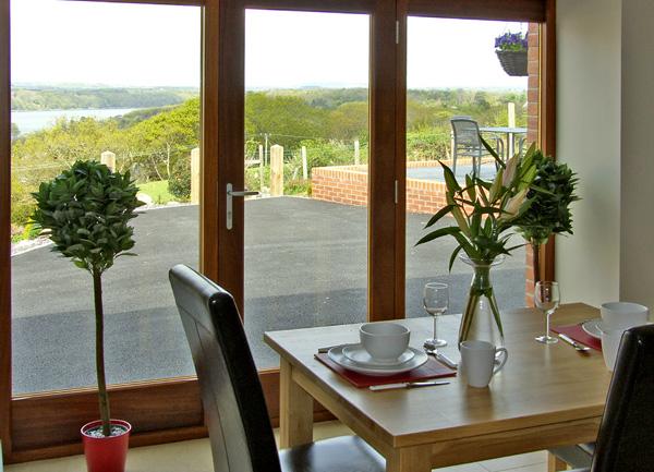 Far reaching rural views from the dining table through French windows.
