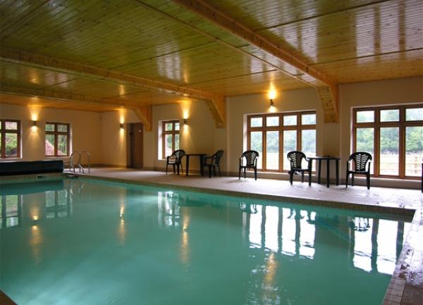 An indoor heated swimming pool at Allerford Cottage.