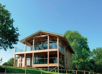 A 3-storey, wood and glass holiday home in a rural location.