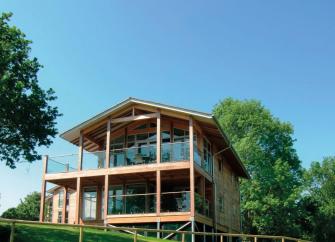 A 3-storey, contemporary wood and glass holiday lodge.