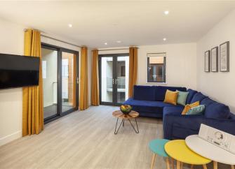 Spacious, open-Plan interior of a modern seaside holiday apartment.