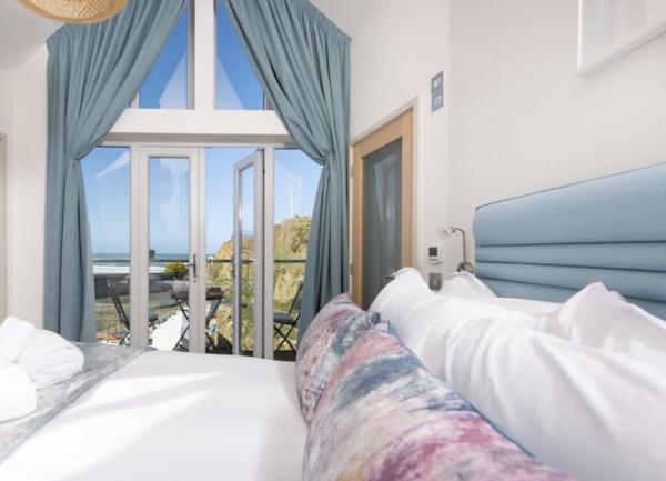Double bedroom with French windows to a balcony.
