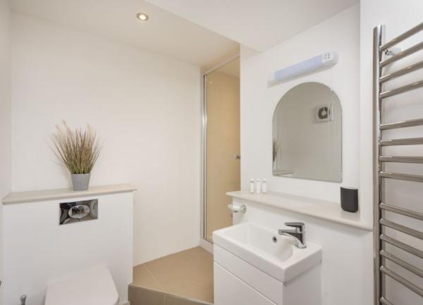 WC, basin and toel rail in an ensuite bathroom.