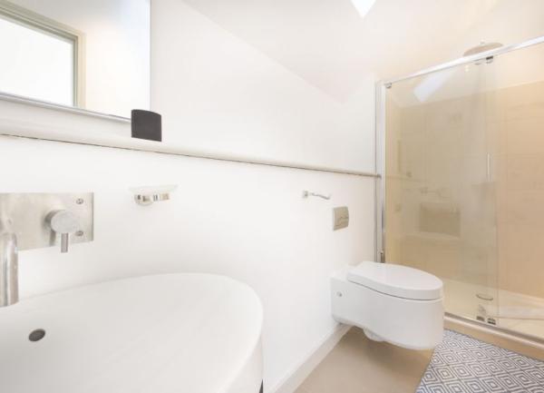 Shower room with shower, toilet and wash basin.