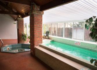 An indoor heated swimming pool at a Pickering holiday cottage