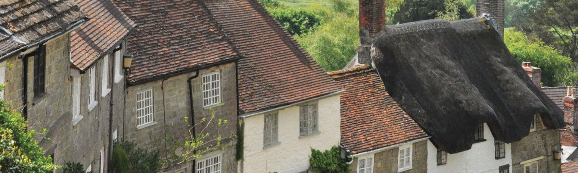 A terrace of traditional village cottages on the steep Gold Hill in Shaftesbury, Dorset