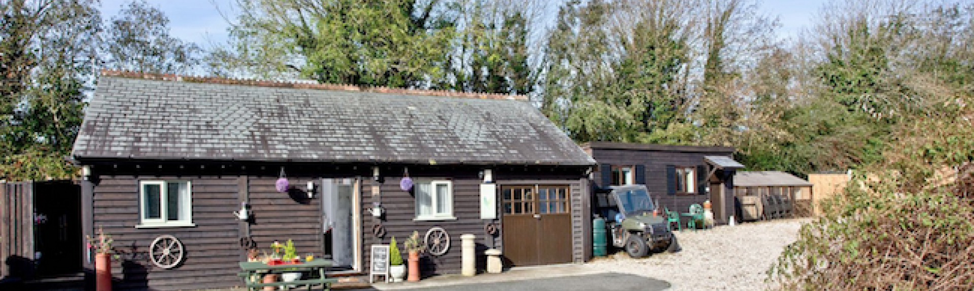 A single-storey wooden holiday lodge in St Columb Major