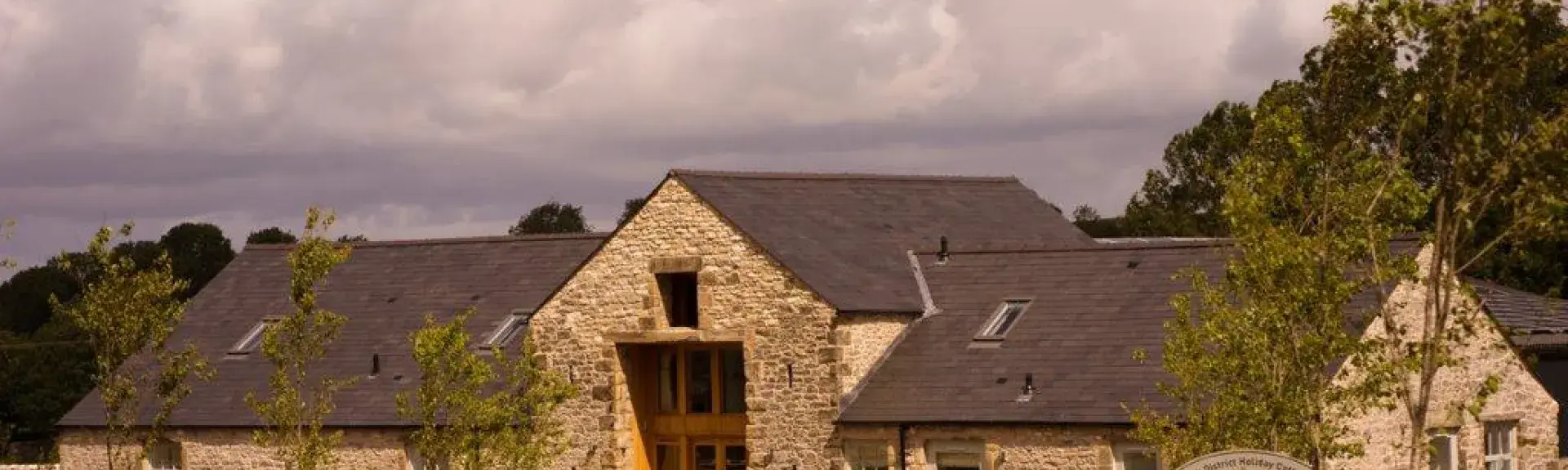 Peak District, stone-built farmhouse and garden.