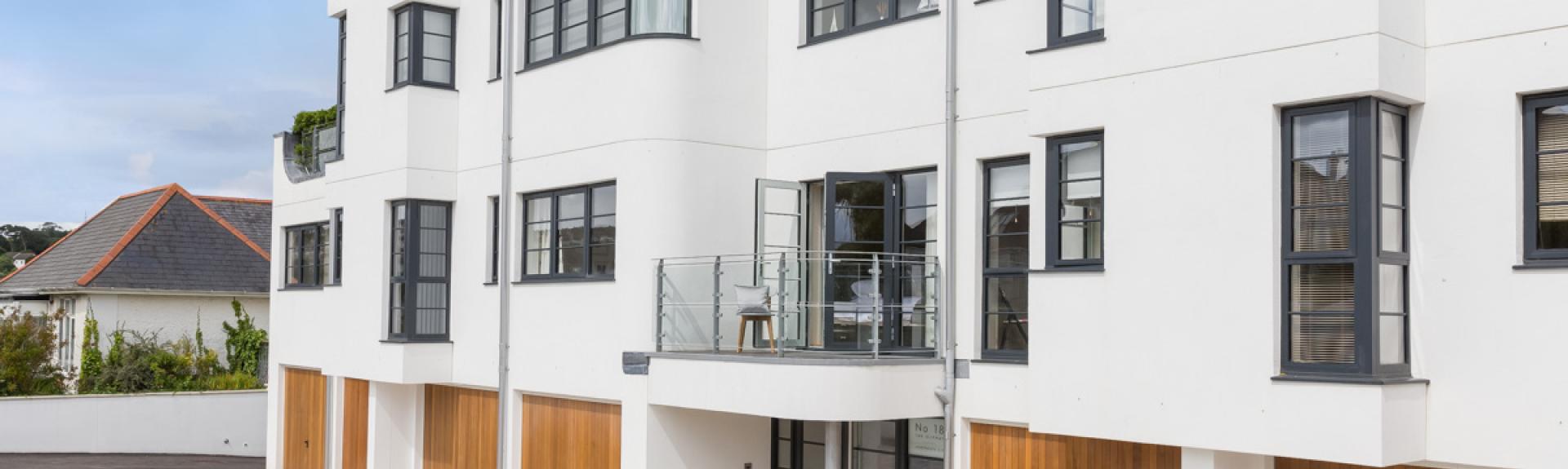 Exterior of a row of modern 3-storey holiday apartments in Falmouth.