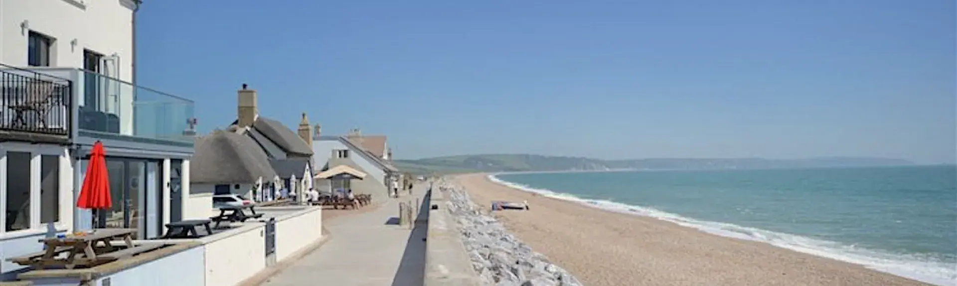 A holiday apartment overlooks a long sandy beach in South Devon.