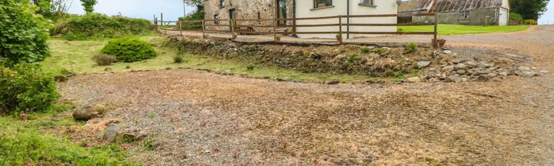 A Pembrokeshire stone barn conversion surrounded by fields.