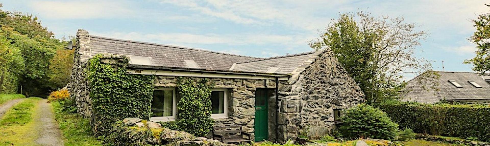 Nestling into a bend on a remote country lane this Gwynedd rural retreat is a single-storey barn conversion.torey barn conversion nestles into a bend in a country lane