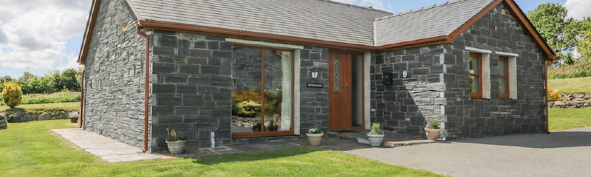 A stone built anglesey holiday home in open countryside.