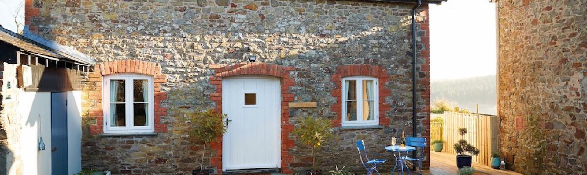 A stone-built barn conversion in North Devon overlooks a farm courtyard