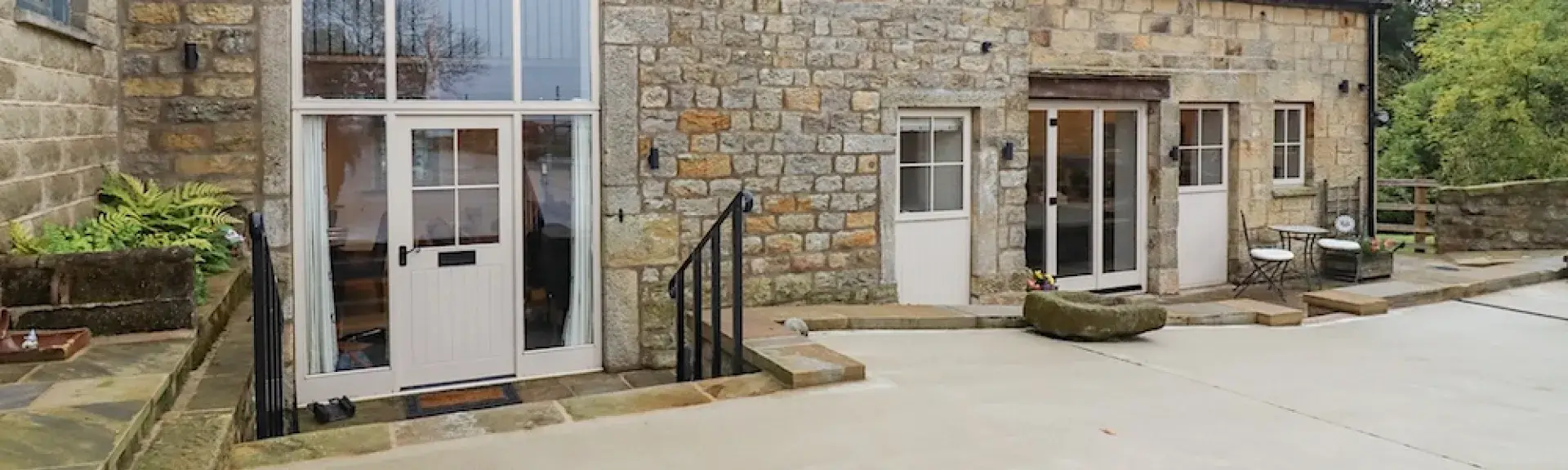 A large bArn conversion in Pateley Bridge with a central 2-storey arched window.